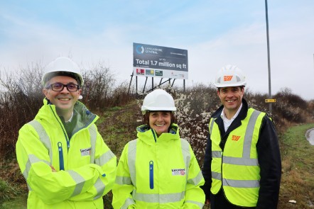 County Councillor Aidy Riggott (left) with County Councillor Williamson (centre) and James Scott from Maple Grove Developments (right) stood in front of one of the new signs.