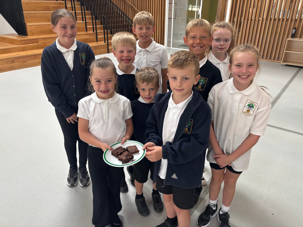 Children at Linkwood Primary holding ChocoPea brownies
