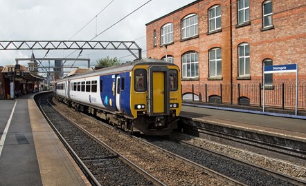 Image shows Northern train in city centre
