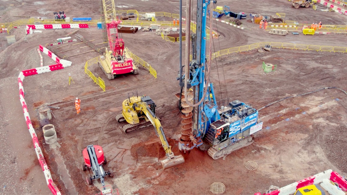 30 metre tall piling rigs building the foundations for the new station