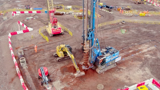 30 metre tall piling rigs building the foundations for the new station