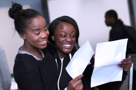 Elizabeth Rafael, 18, and Keitro Browy, 18, of Cardinal Pole school celebrate their results