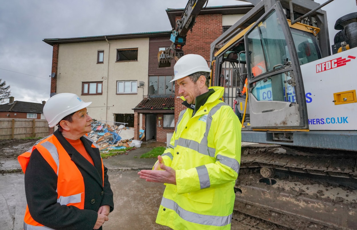 Kingsdale 1: Councillor Mary Harland, Leeds City Council’s executive member for housing, speaks with Gerard Kelly, from demolition contractor Connell Brothers Ltd, at the former Kingsdale Court flats complex in Seacroft, Leeds.