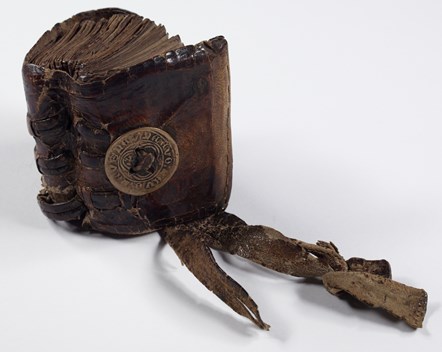 This volume was designed to be worn on the belt.  It dates from the 15th-16th centuries and belonged to Niall Óg from a branch of the Beaton family on Islay.  Devotional texts written for him by his father, and medical definitions written by a friend, combine to make a compendium for a young medical