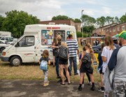 Party for the warren - ice cream van: Group of people stood queueing at an ice-cream van