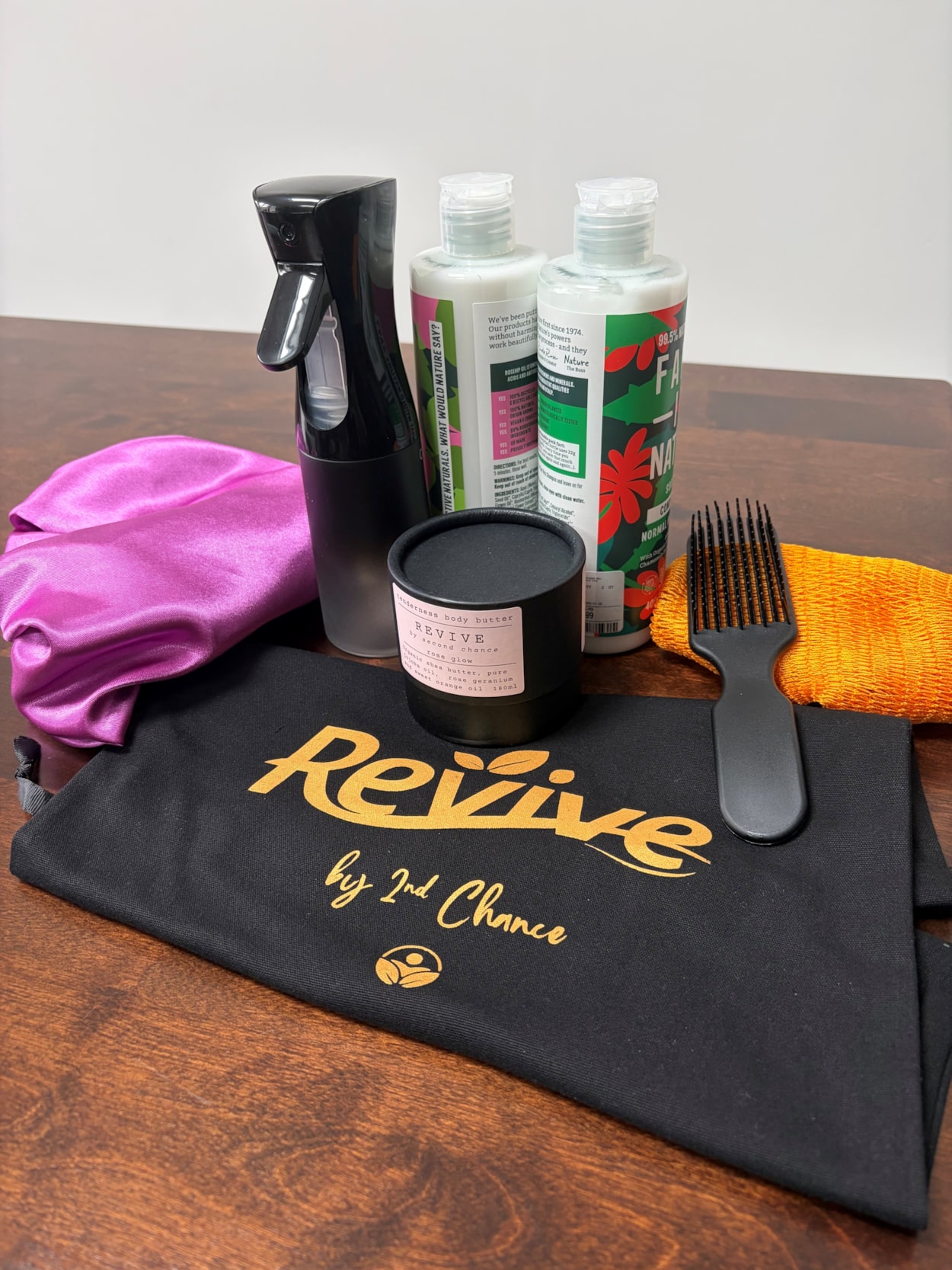 RevivebySecondChance 5: Some of the products included in the 'Revive' bags - including a satin bonnet, brush, spray bottle and body butter.