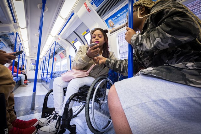 TfL Image - Wheelchair user travelling on the Tube