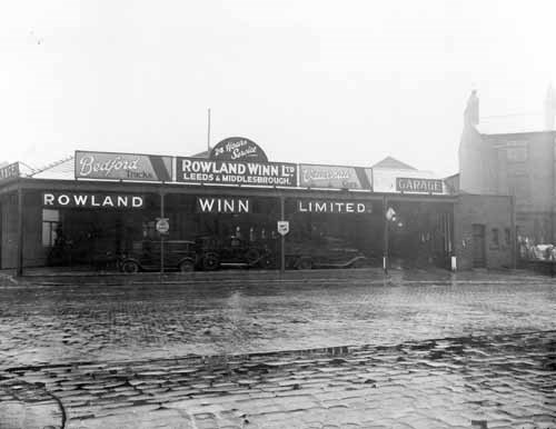 U1 number plate: View of the garage premises of Rowland Winn Ltd. situated on Woodhouse Lane at number 62A, adjacent to the junction with St. Columba Street taken in 1936. The business was founded by motoring pioneer Rowland Winn, who bought the U1 number plate used by Lord Mayors of Leeds. Credit Leeds Libraries.