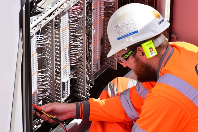 Engineer checking signalling wires
