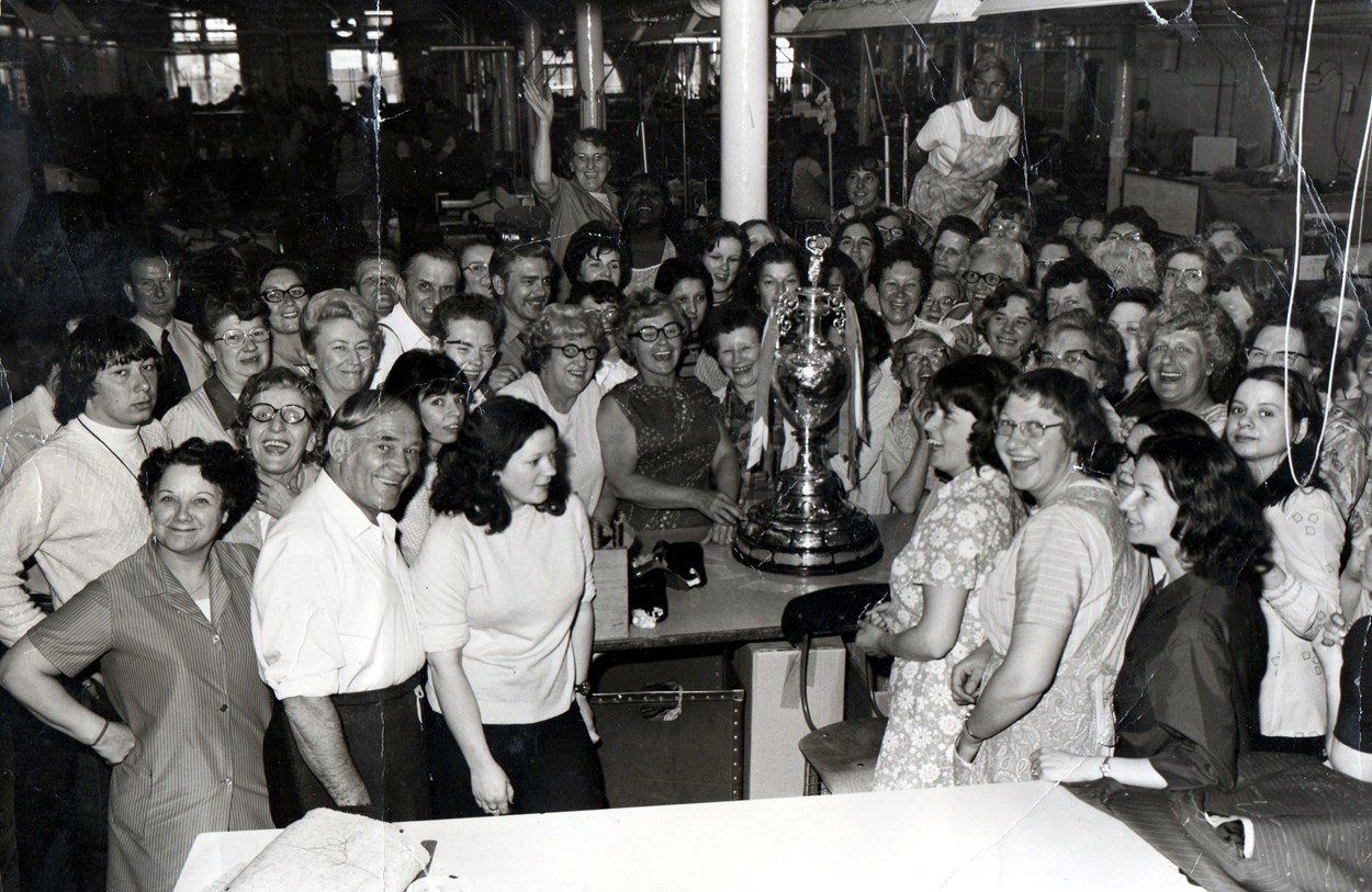 Hepworths Ltd staff with the 1974 football league trophy. Copyright: Leeds Libraries, Leodis.net