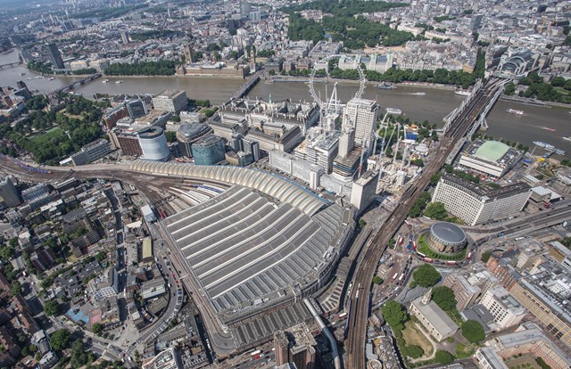 aerial -  Waterloo and Charing Cross: London Waterloo, the pedestrian link to Waterloo East is bottom centre. Charing Cross is top right, Buckingham Palace top middle, London Eye in the middle, IMAX cinema middle right, and the Palace of Westminster (Parliament) top left. The church at bottom right is St John's
