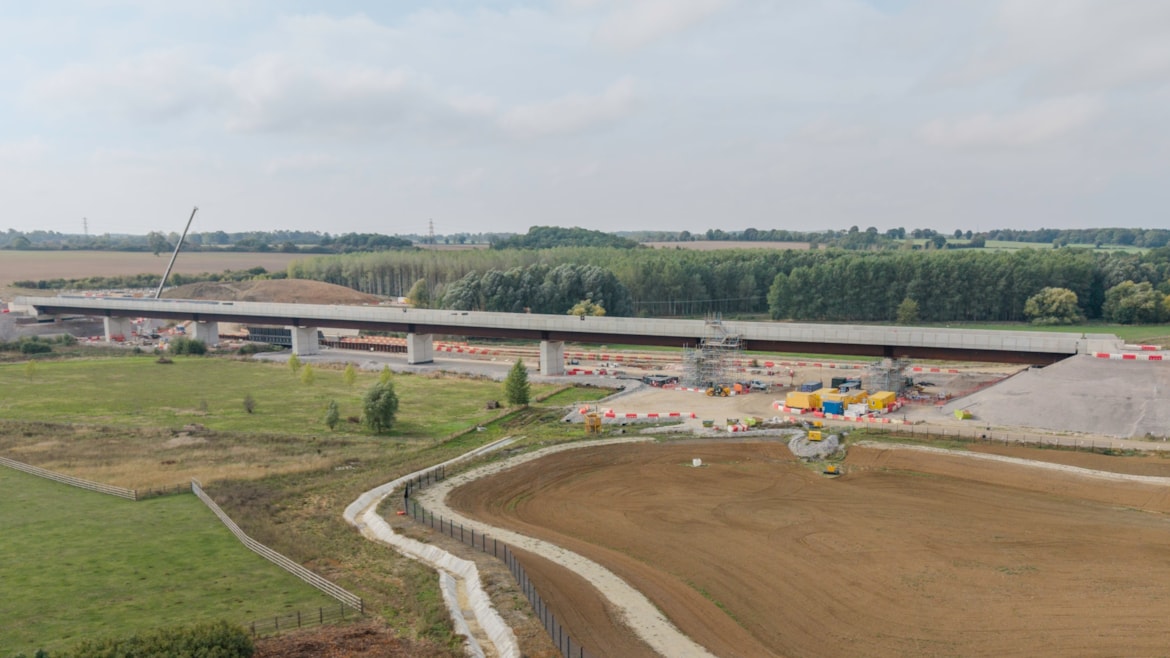 HS2 completes 320m-long Westbury viaduct: View of the completed Westbury viaduct with a balancing pond being constructed in the foreground Oct 2026