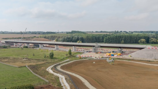 HS2 completes 320m-long Westbury viaduct: View of the completed Westbury viaduct with a balancing pond being constructed in the foreground Oct 2026