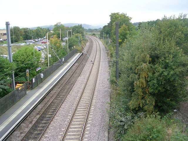 Always credit with following from Wiki Commons:
Betty Longbottom / View from Bridge TRJC3-76B - Station Road / CC BY-SA 2.0