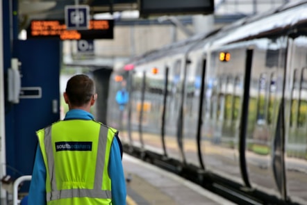 Stock image of a train and a Southeastern employee