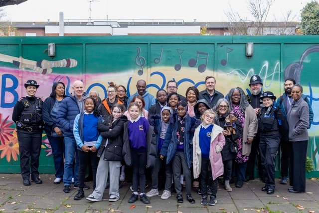 7. Cllr Susan Fajana-Thomas OBE, with pupils from Kingsmead and Mandeville primary schools, and members of the Pedro Club, Community Gangs Team and local police