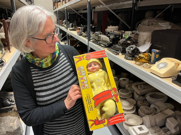 Biscuit messages: As well as the biscuit messages, other festive objects which have been recently donated to Leeds Museums and Galleries include a late 1960s Cutie doll, gifted to a child whose family was homeless in 1969 as part of the Leeds and District Workpeople’s Hospital Fund’s annual Christmas appeal. Held here by curator Kitty Ross, it still carries the note “To Denise Xmas 1969, from mummy and dad.”