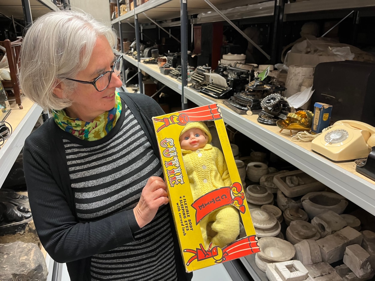 Biscuit messages: As well as the biscuit messages, other festive objects which have been recently donated to Leeds Museums and Galleries include a late 1960s Cutie doll, gifted to a child whose family was homeless in 1969 as part of the Leeds and District Workpeople’s Hospital Fund’s annual Christmas appeal. Held here by curator Kitty Ross, it still carries the note “To Denise Xmas 1969, from mummy and dad.”
