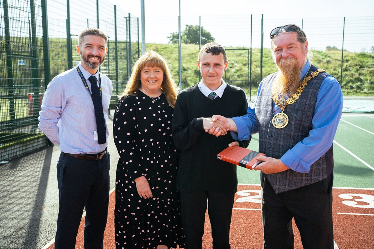 DH Mr Johnston, Cllr Cowan, Gregor and Provost Todd, who is presenting Gregor with a gift