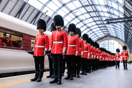 Coldstream Guards at London King's Cross alongside an LNER Azuma