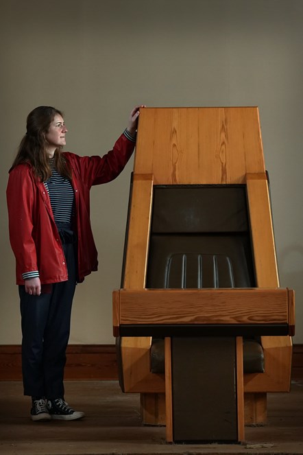 Curator Georgia Vullinghs with the Speaker's Chair which has been donated to National Museums Scotland (credit Stewart Attwood)