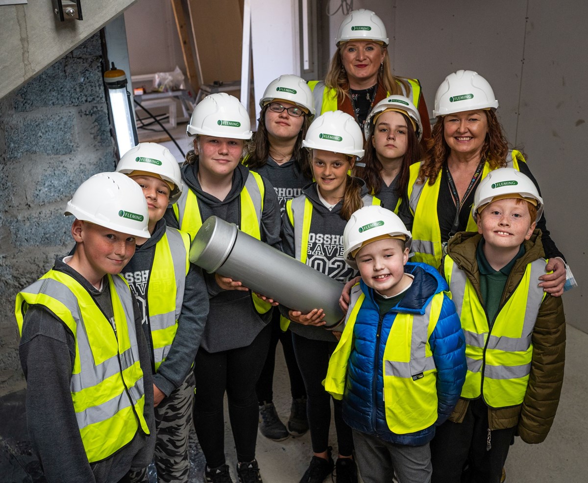 Head Teacher Tina Gaitens, P7 House and Vice Captains Oliver, Josh, Lucy, Lynsey, Caitlyn and Faith; Charlie and Mason and Linda McAulay-Griffiths , Chief Education Officer, Head of Education