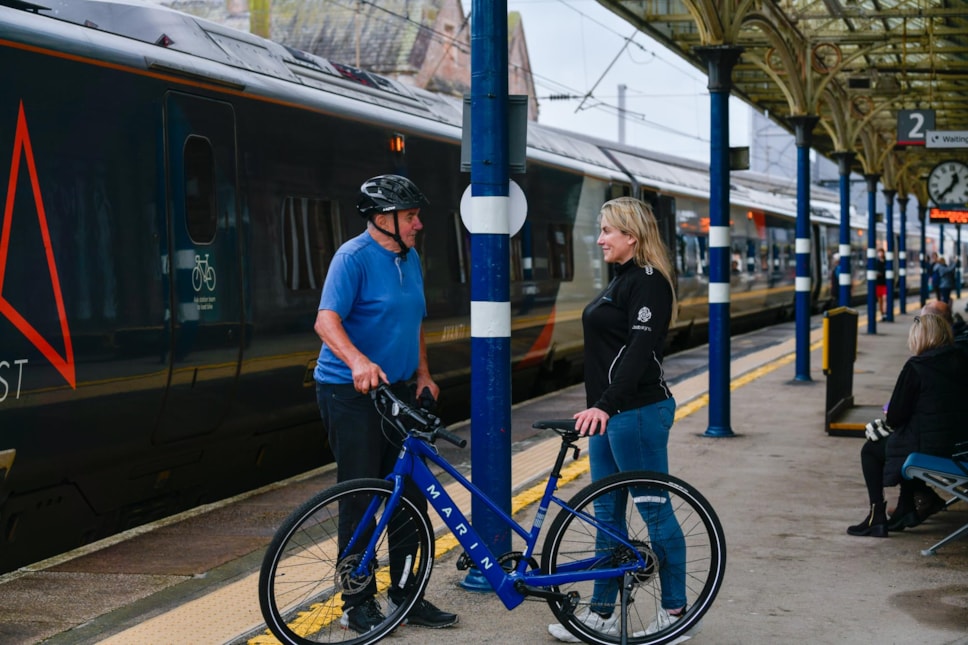 The Arragon's Cycles team deliver an e-bikes to a visitor at Penrith station as part of its e-bike hire service