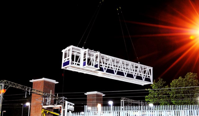 First bridge span is swung into place: The first of two bridge spans linking platform 1 with the island platforms 2 & 3 is swung into position during the royal wedding/May Day bank holiday weekend.