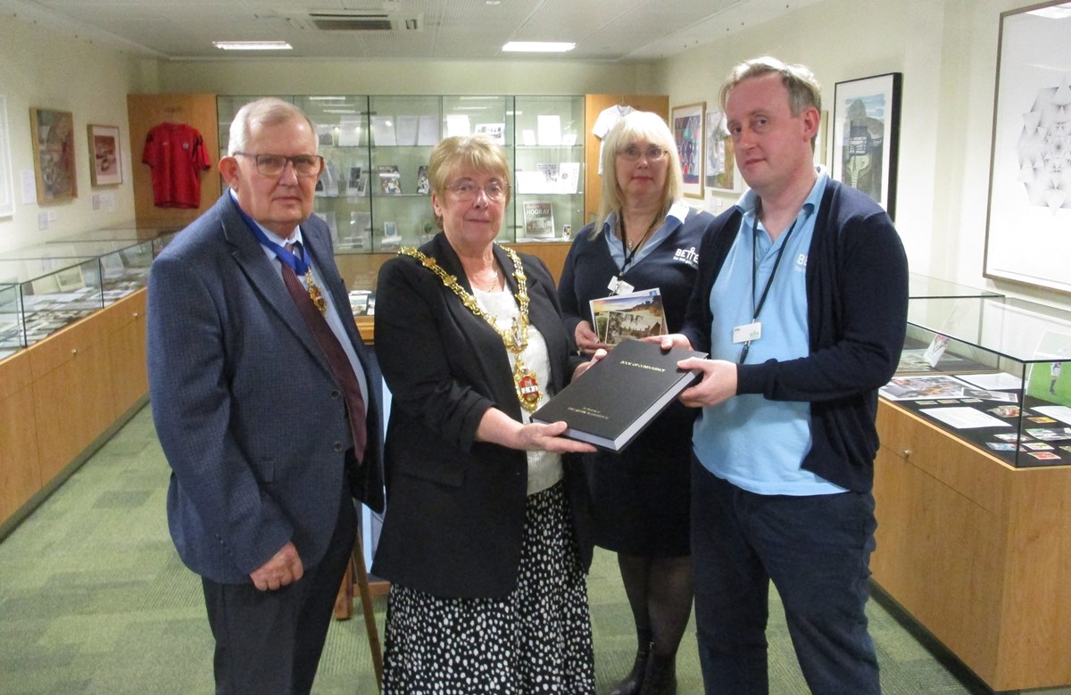 Mayor and consort presents archives staff Jane Humphrey and Mike Bevan book of condolences at archives