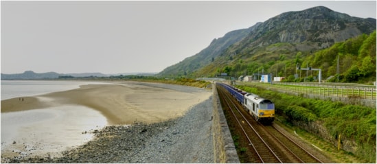 HS2 aggregate train running along the coast near Penmaenmawr May 2025: CREDIT: DC Rail