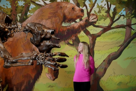 Connie Blacklaw (11)  meets a giant ground sloth at the National Museum of Scotland’s exhibition Giants. Photo © Stewart Attwo