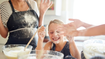 Girls having fun while baking GettyImages-522471250