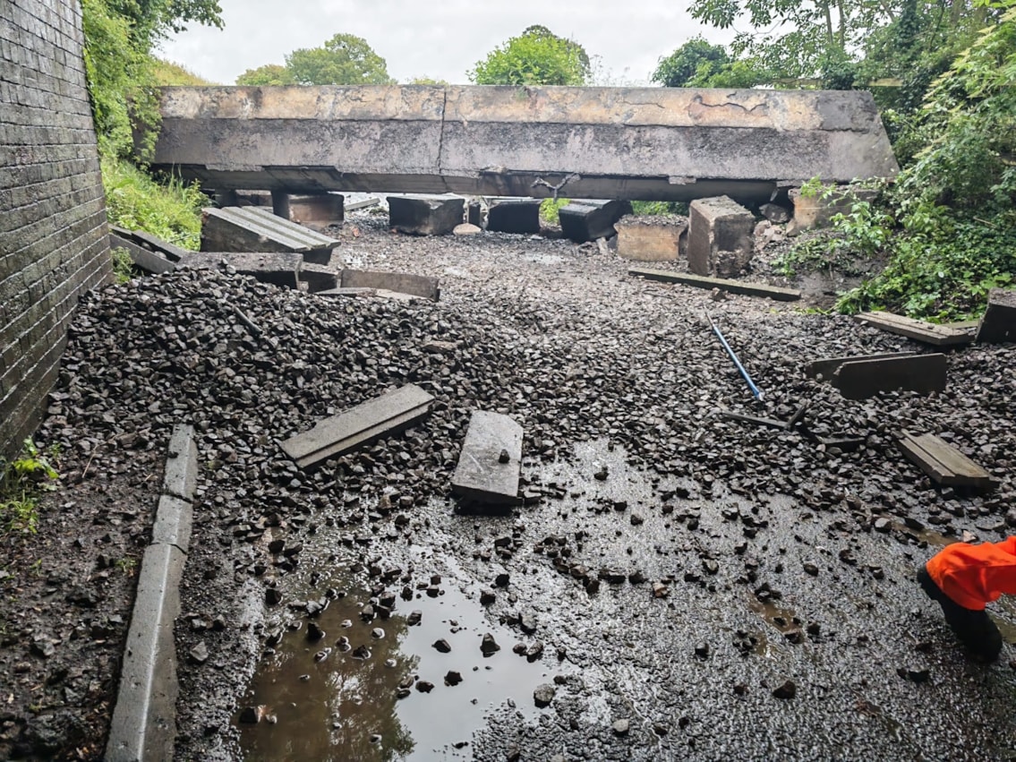Image shows section of railway bridge on road following collision in Bedworth