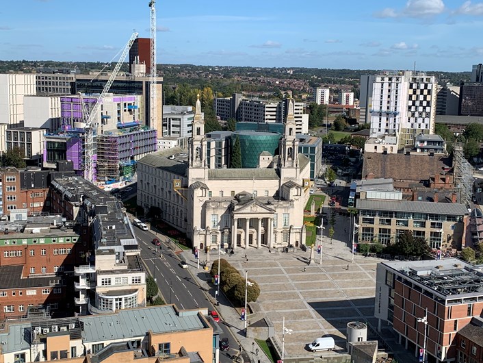 City lights up to remember COVID-19 victims: Leeds Civic Hall Millennium Square aerial