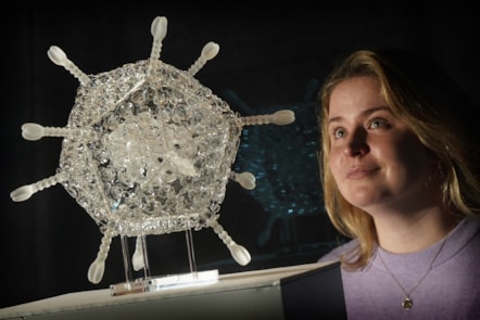 Curator Sophie Goggins with Sculpture of the Oxford-AstraZeneca Covid-19 vaccine in glass by Luke Jerram. The artwork is on display in Injecting Hope, a new exhibition at the National Museum of Scotland today.

Photo ©  Stewart Attwood