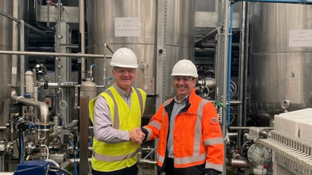 Rupert Maitland-Titterton congratulates ALan Findlay (R) Plant Manager on the completion of the Glenrothes manufacturing site
