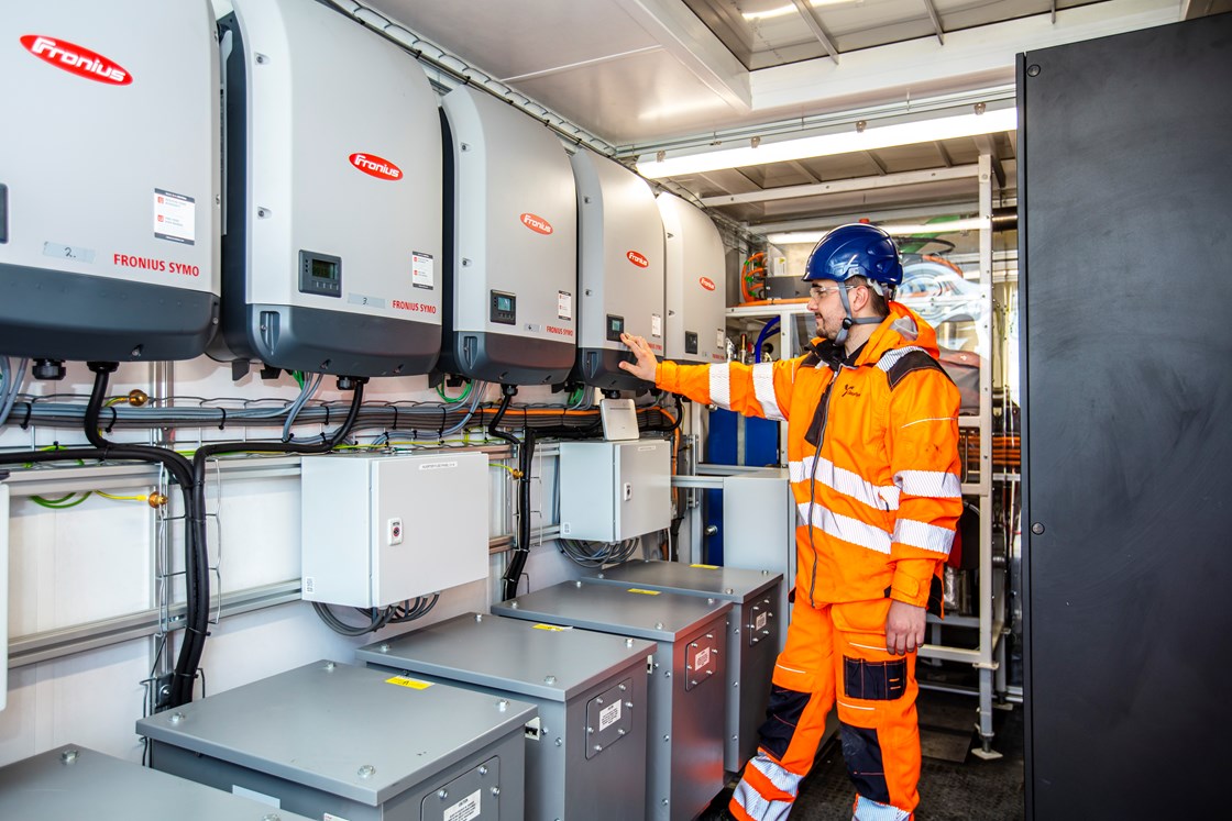 GeoPura representative inspecting the invertors inside the HPU