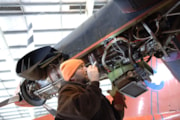 An engineer works on a BAS aircraft. BAS.: An engineer works on a BAS aircraft. BAS.