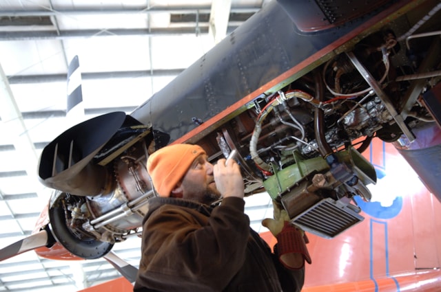 An engineer works on a BAS aircraft. BAS.