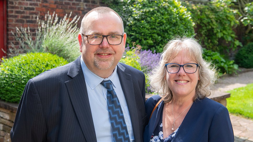 Ian and Mandy Sinker, pictured on 20 July 2023, at University of Cumbria graduations. The couple has enjoyed a 40-year connection to the university's Lancaster campus, formerly St Martin's College where they met as students and later married on campus with both continuing to work with the campus during their careers.