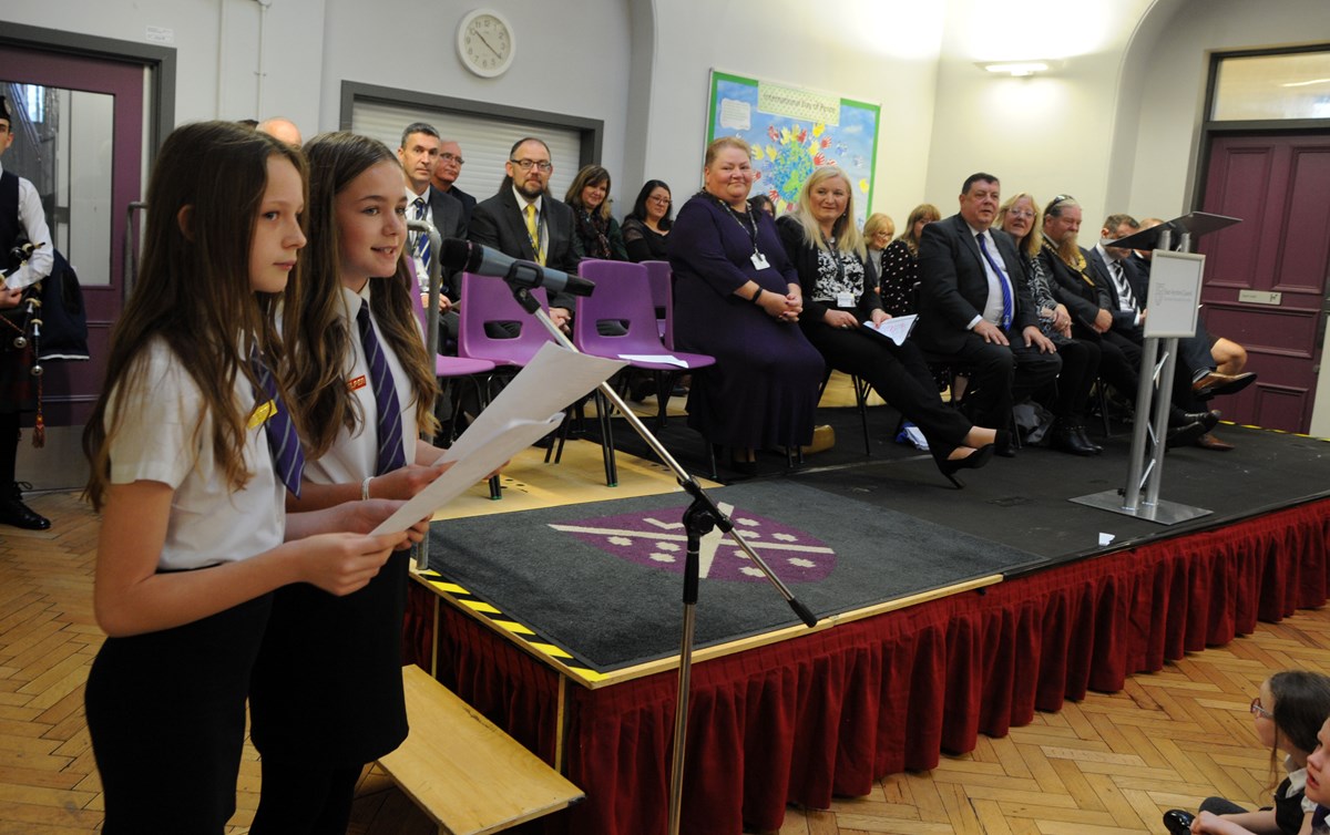 Amelia and Olivia read a poem as part of the celebrations