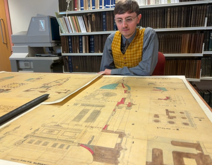 Leeds Town Hall clock tower: Archives assistant Alex Pearson with the plans for the Leeds Town hall clock tower.
Created in 1857, a year before the building was opened by Queen Victoria, the elaborate illustrations are part of the collection at West Yorkshire Archives Service and include the classical stonework and emblematic owls adorning the tower exterior.
They were prepared as part of the “articles agreement” put together by contractors Addy and Nicholls, who took on the mammoth task of constructing the tower.