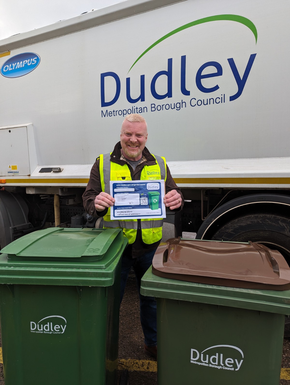 Cllr Damian Corfield holding one of the new garden waste permits