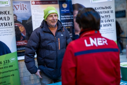 SAMARITAN LISTENING VOLUNTEER TAKLING TO LNER COLLEAGUE