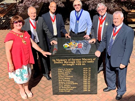 Past Mayors group with plaque