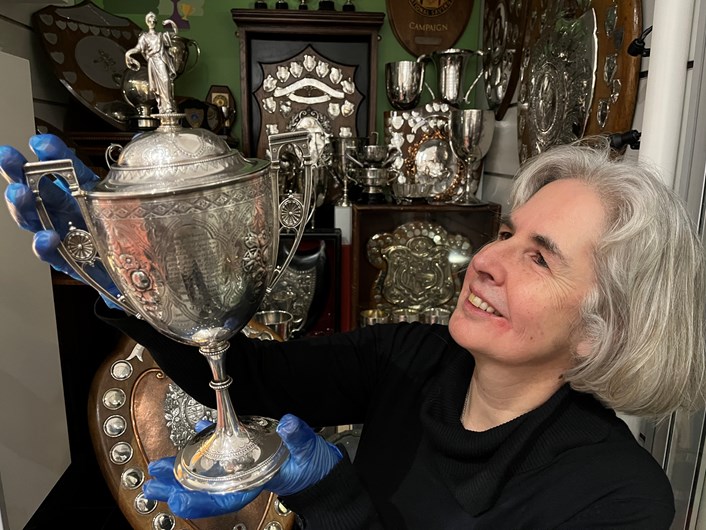 All to Play For: Kitty Ross, Leeds Museums and Galleries curator of social history with a dazzling cabinet stuffed with accolades awarded for everything from darts and billiards to hairdressing and rose-growing which are on show as part of the exhibition.
