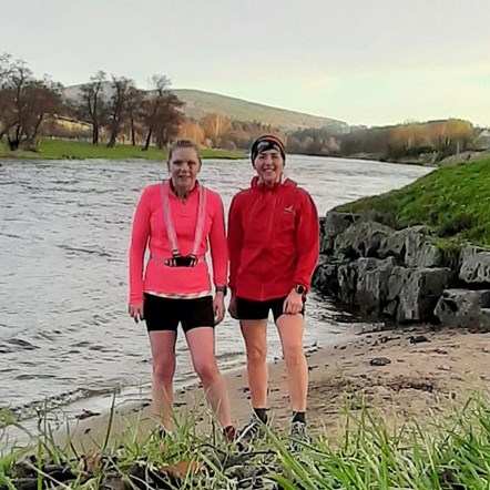 Marie Third (left) who won 1st prize in the Most Distance Covered category of the Speyside Challenge, covering 342.5kms on foot, stops for a breaks at a river's edge with her running friend.