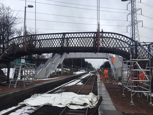 New station footbridge opens at Addiewell: 11 March cuttign the bridge
