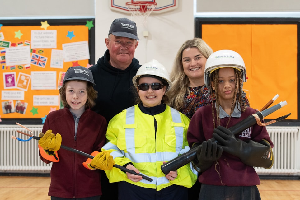 Electricity North West's Trevor Green, teacher Tylena Green and pupils from Blackrod Primary