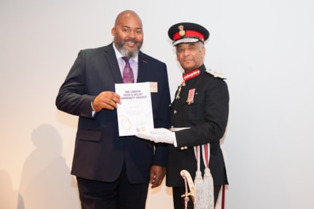 Pastor Junior Spence receiving Pray4Youth's award from Dr Dangoor